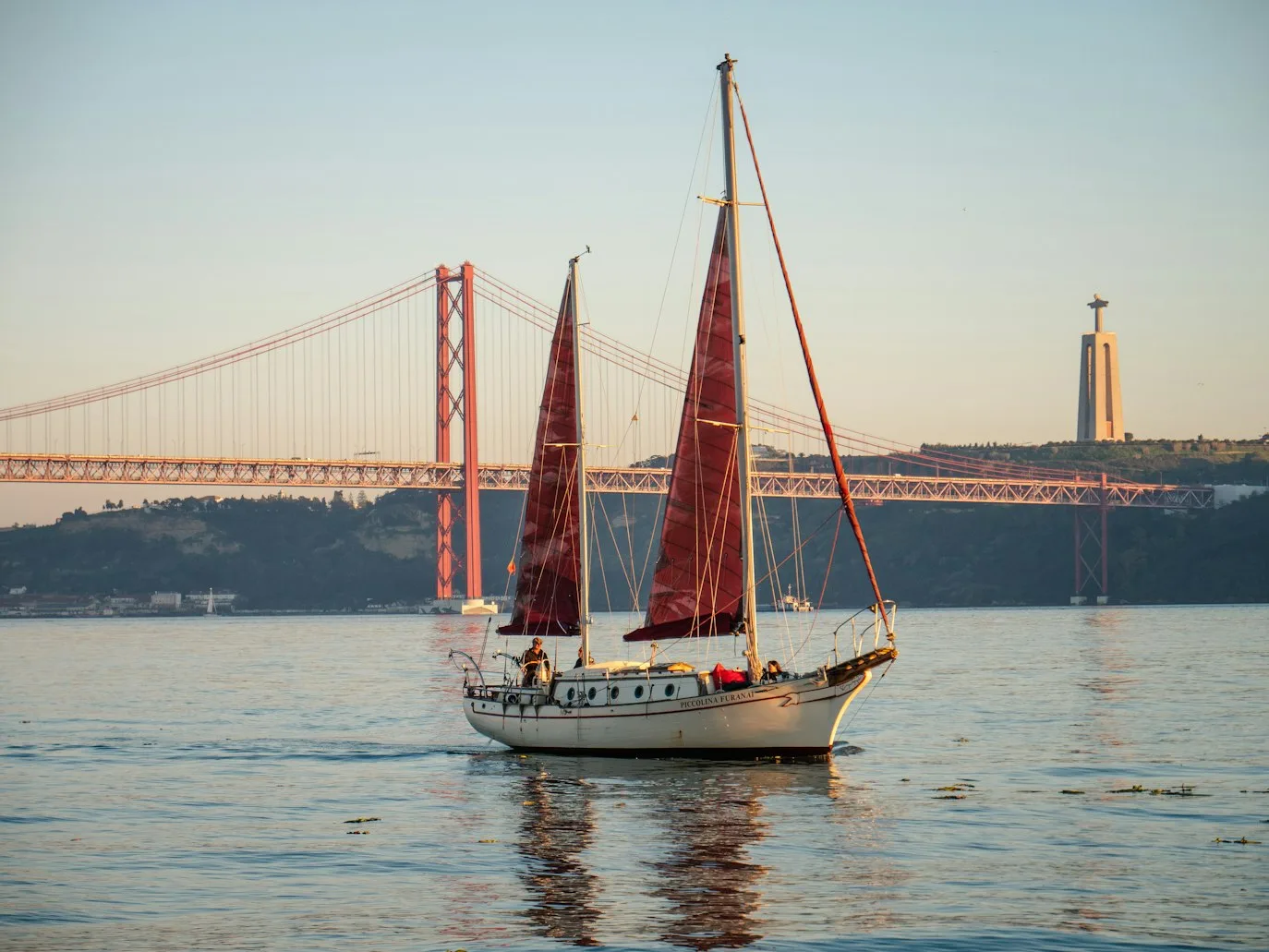 Viewpoint over Lisbon at golden hour with the river beyond